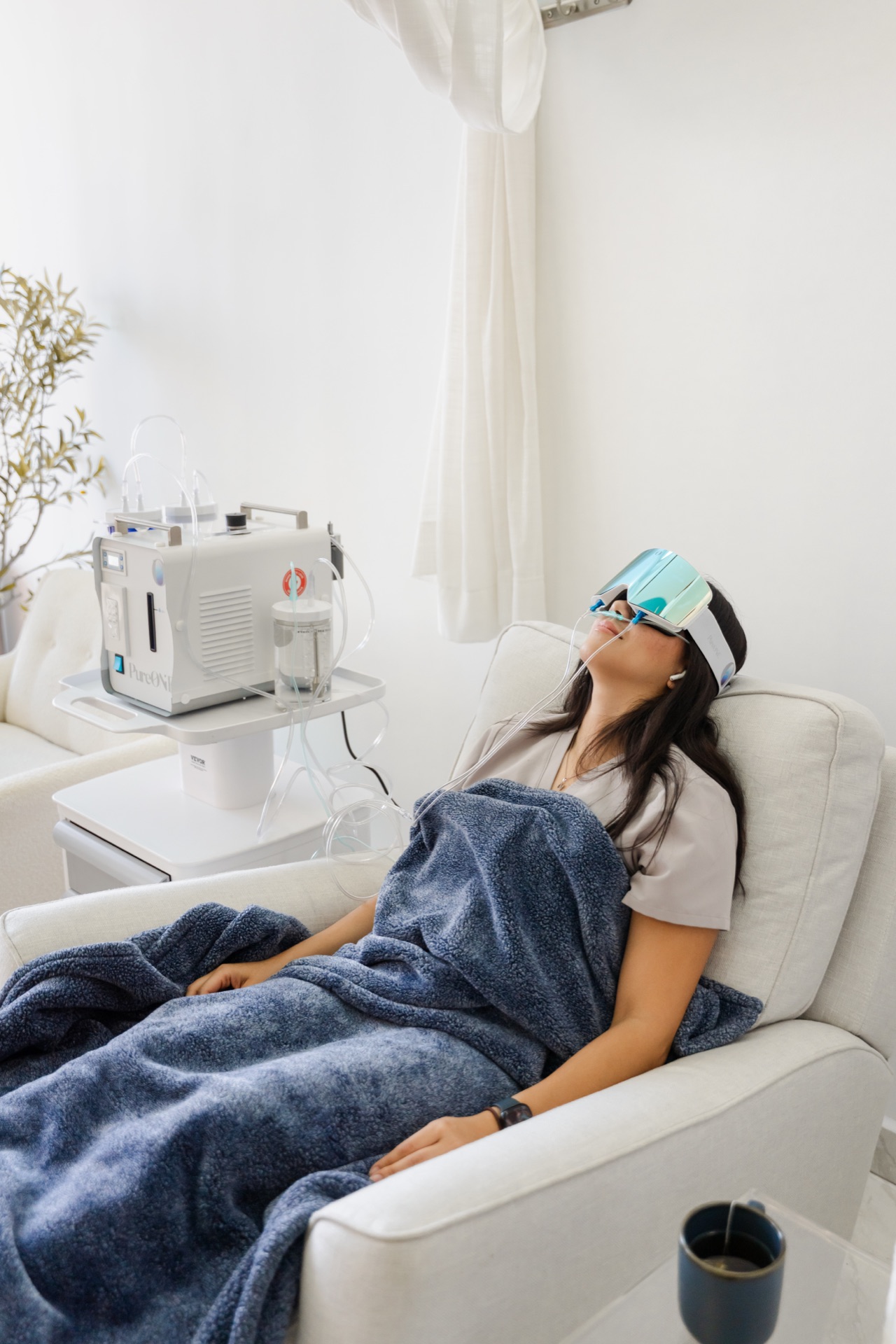 Patient relaxing with an eye mask during a regenerative treatment session